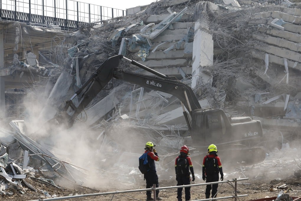 Rescuers conduct a search for survivors on Friday at the site of the collapsed State Audit Office tower building in Bangkok. Photo: EPA-EFE