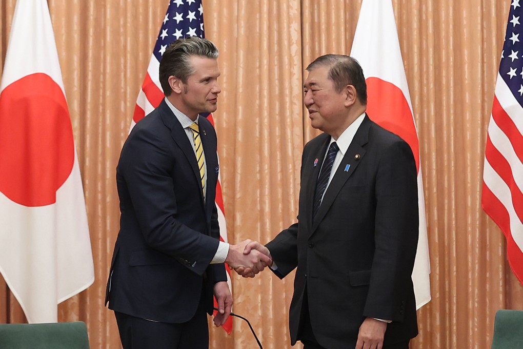 US Defence Secretary Pete Hegseth shakes hands with Japanese Prime Minister Shigeru Ishiba in Tokyo on Saturday. Photo: Kyodo
