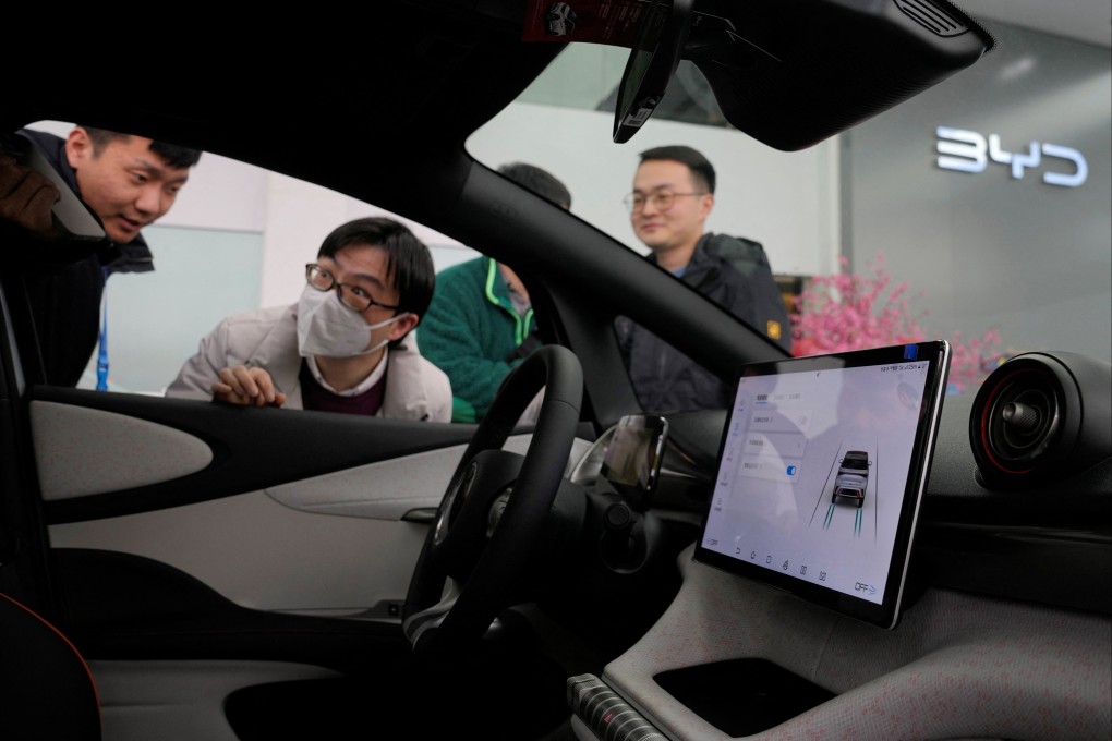 People check a BYD electric vehicle in Shanghai. Photo: Reuters