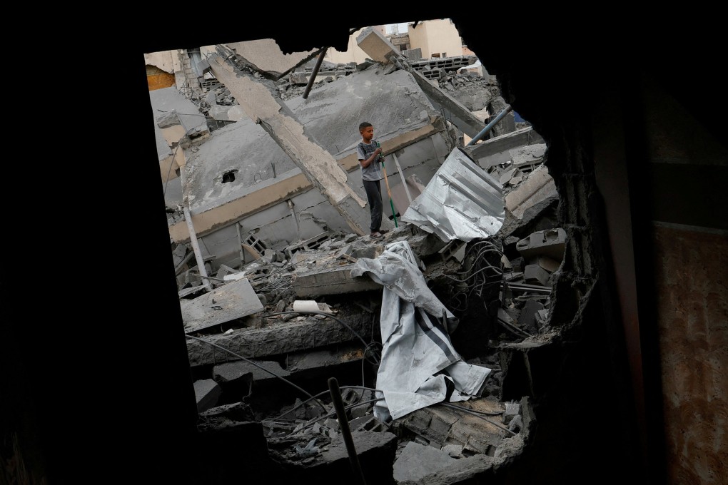 A boy stands on rubble after an Israeli strike on a house in Khan Younis, in the southern Gaza Strip. Photo: Reuters