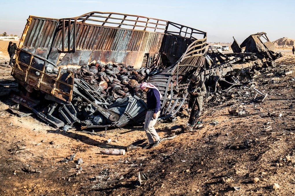 Syrians look for metal pieces and unexploded ammunition at the site of an Israeli air strike in northeastern Syria, on December 10, 2024. File photo: AFP