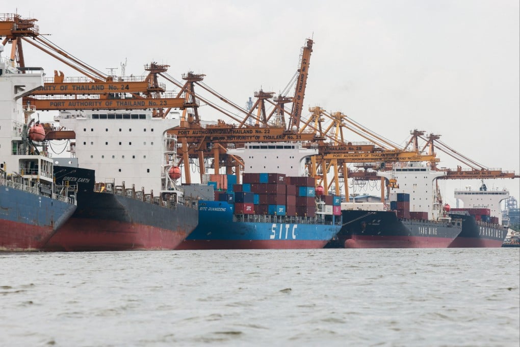 Cargo ships are loaded with containers while docked at the port of Bangkok on Thursday. The US imposed a 36 per cent levy on Thailand. Photo: Reuters