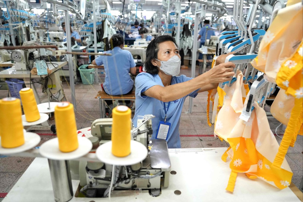 Vietnamese workers stitch garments inside a factory in Ho Chi Minh City. US tariffs on Vietnam also pose a threat to Chinese exporters that have shifted production to the country. Photo: AFP