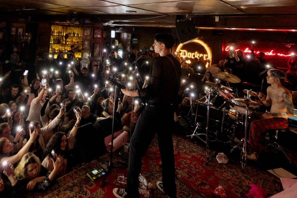 Punk-rock duo Susidy Sterpliat perform a concert in Vinnytsia, Ukraine. An auction was held after the set to raise money for Ukrainian forces. Photo: AFP