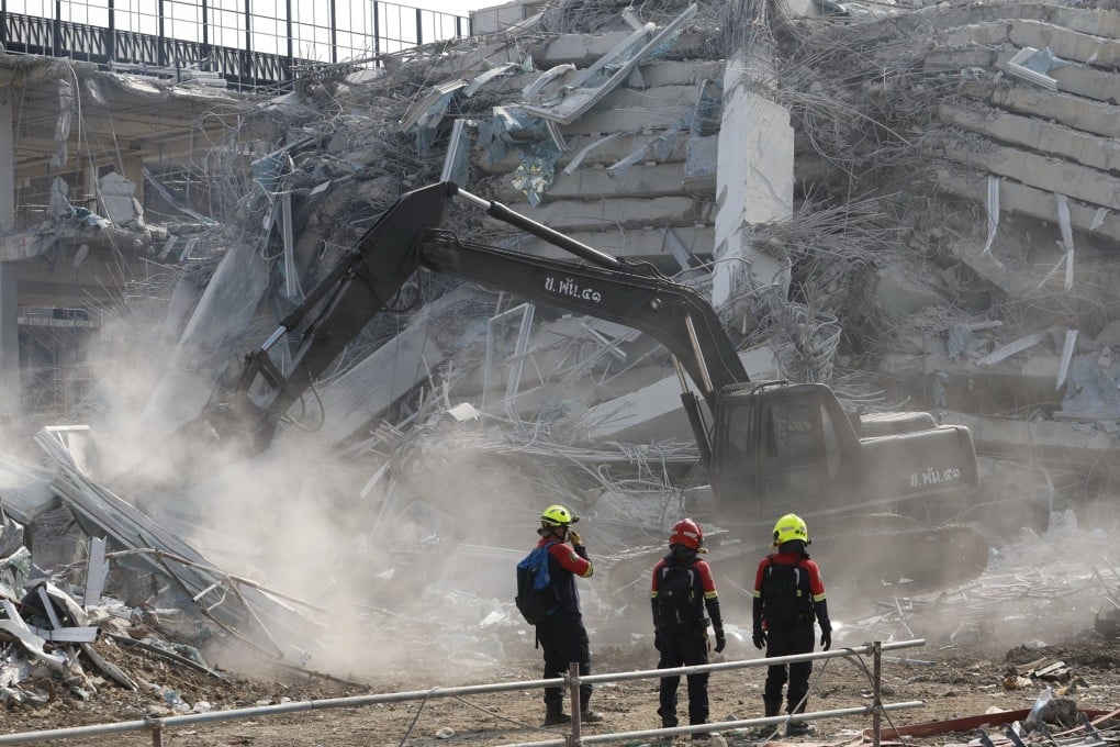 Rescuers search for survivors on Friday at the site of the collapsed State Audit Office tower building in Bangkok. Photo: EPA-EFE