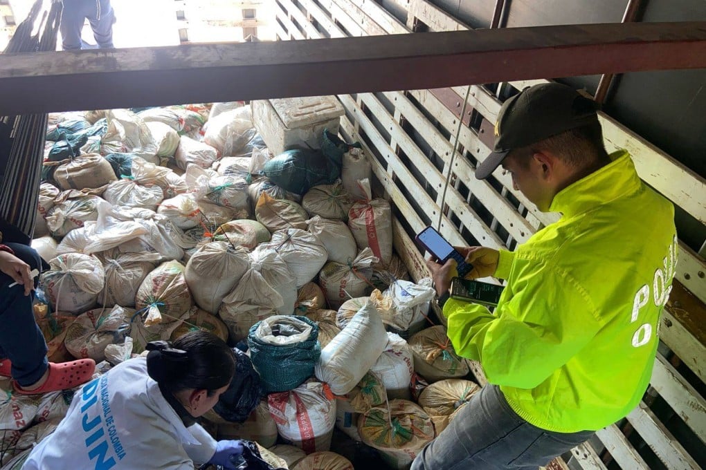 Police check seized sacks of Coltan inside a truck in Villavicencio, Colombia. Photo: Colombian Defence Ministry via AFP