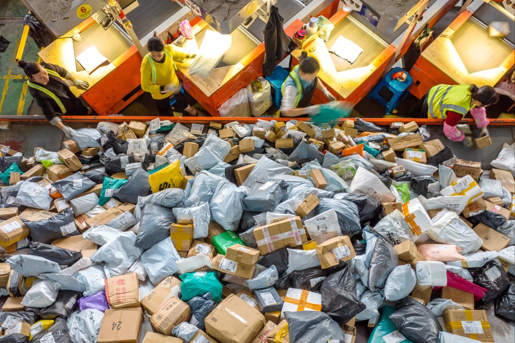 Staff sort out parcels at a logistic company in China’s Zhejiang province. Packages shipped from China to the United States and worth less than US$800 will not be exempt from entering the US duty-free. Photo: Xinhua