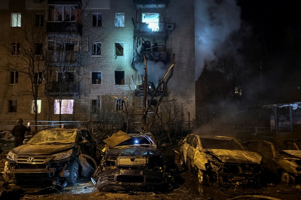 Destroyed cars and an block of flats damaged by a Russian drone strike in Kharkiv, Ukraine on Thursday. Photo: Reuters