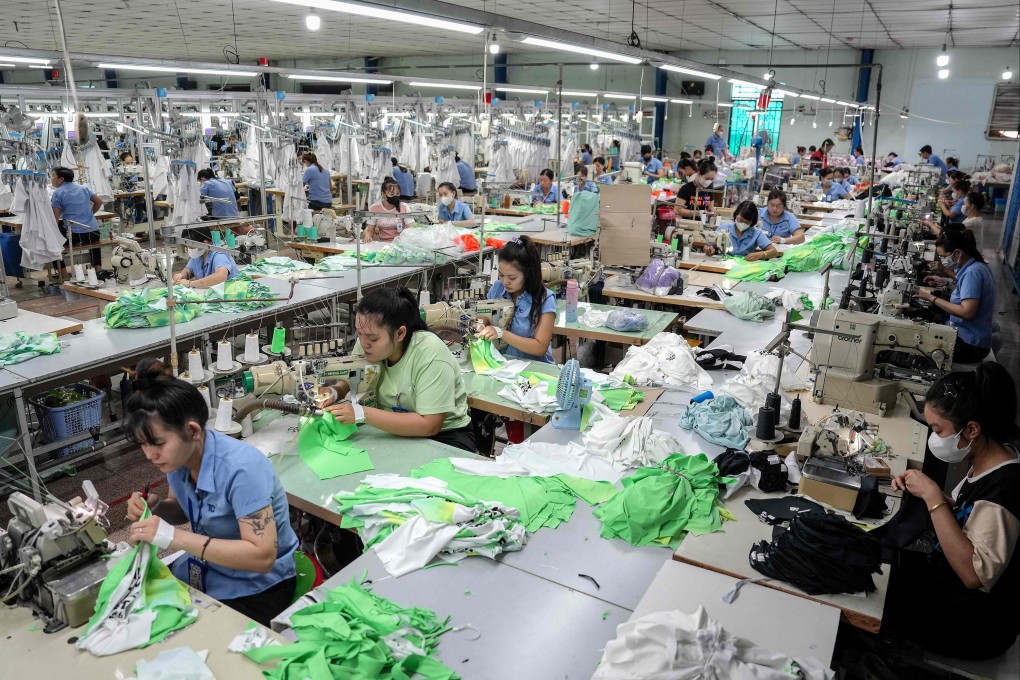 Vietnamese workers stitch apparel at a garment factory in Ho Chi Minh City on April 3. Photo: AFP