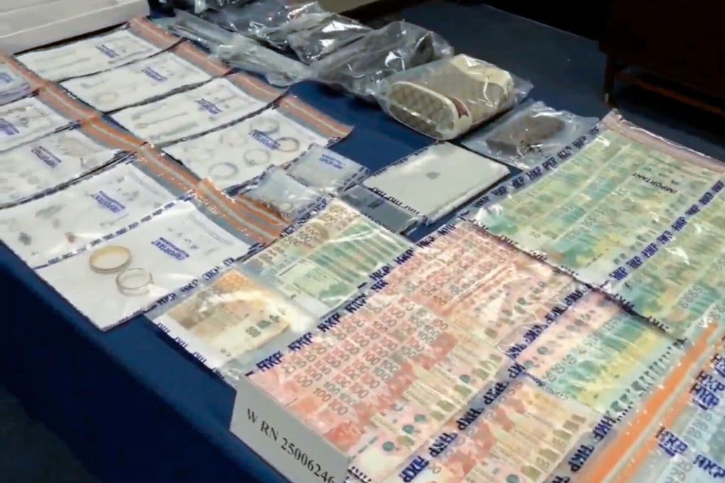 Police display jewellery and cash allegedly stolen from luxury residences. Photo: Handout