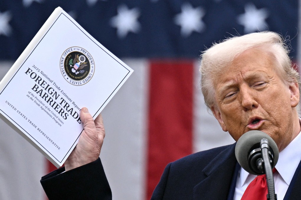 US President Donald Trump with the report that provided the basis for the reciprocal tariffs he imposed on Wednesday. Photo: AFP/Getty Images/TNS