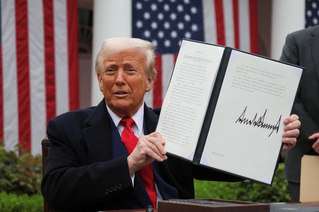 Donald Trump holds a signed executive order on tariffs in the Rose Garden at the White House. Photo: Reuters