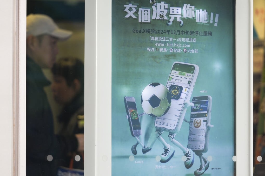 An advertisement for the Hong Kong Jockey Club’s eWin app at a betting branch in Sheung Wan. Photo: Eugene Lee