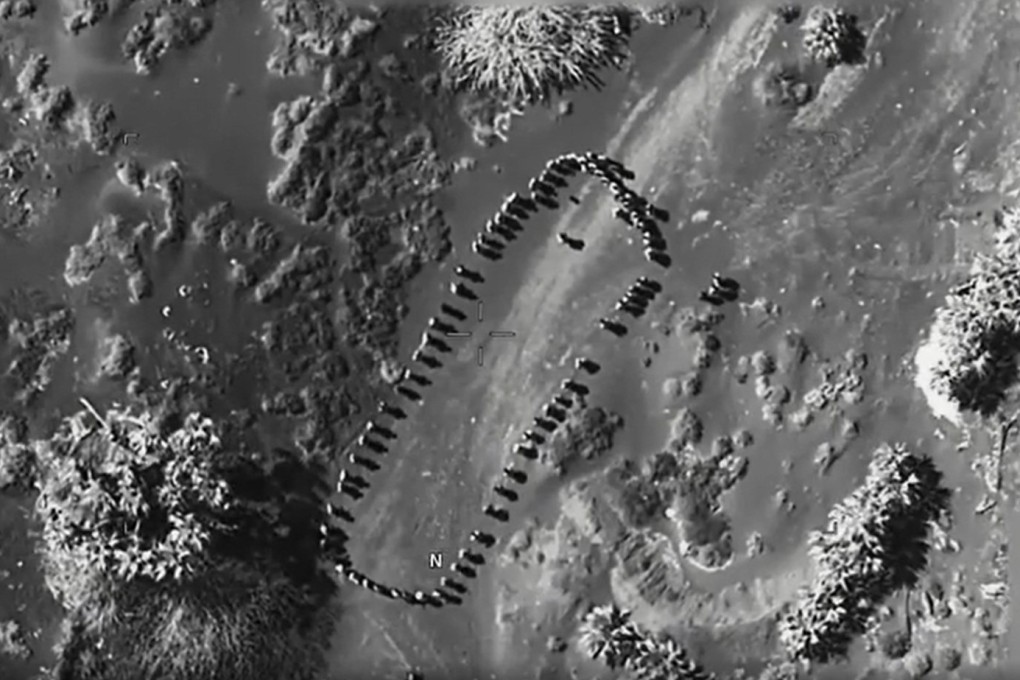 Footage posted to social media by US President Donald Trump shows several dozen human figures from an almost vertical angle. Photo: Truth Social/realDonaldTrump