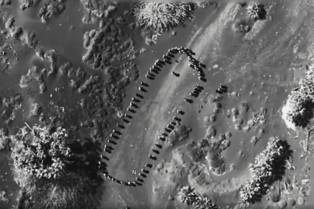 Footage posted to social media by US President Donald Trump shows several dozen human figures from an almost vertical angle. Photo: Truth Social/realDonaldTrump