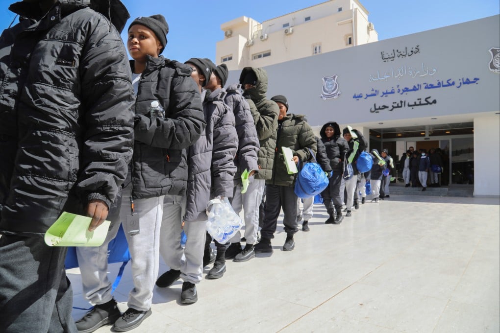 Around 180 Nigerian migrants stand in line before being deported from Tripoli, Libya, on March 18. Photo: AP