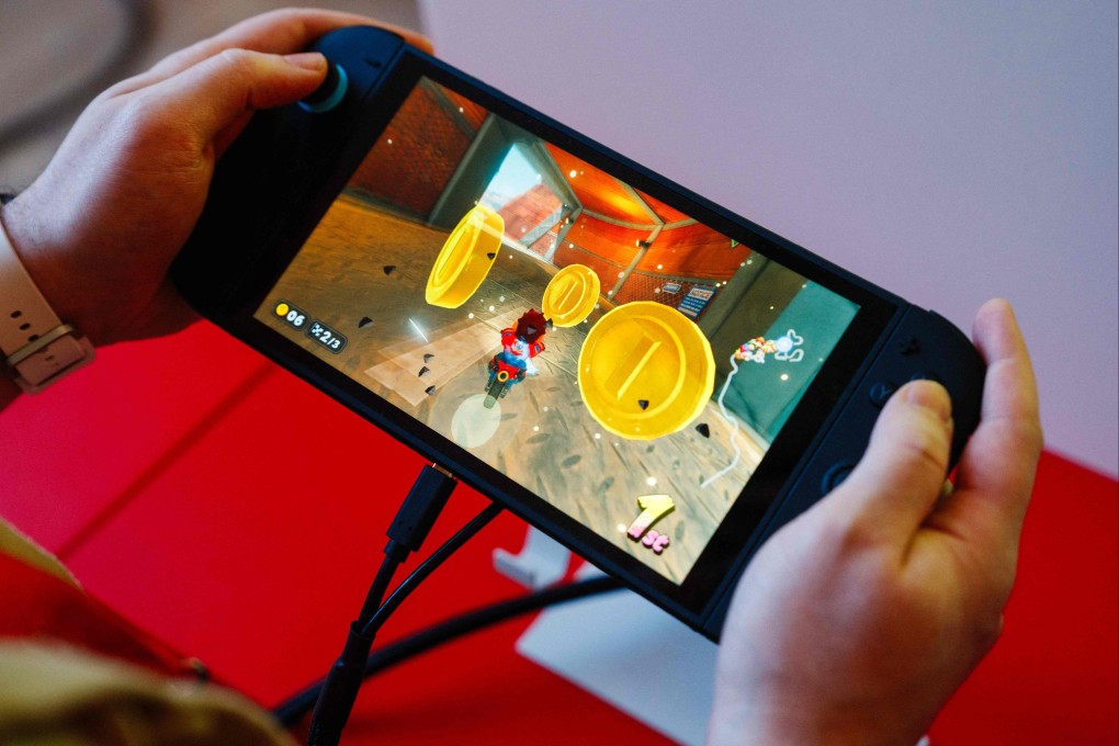 A guest plays Mariokart World on the new Nintendo Switch 2 during a presentation at the Grand Palais in Paris on Wednesday. Photo: AFP