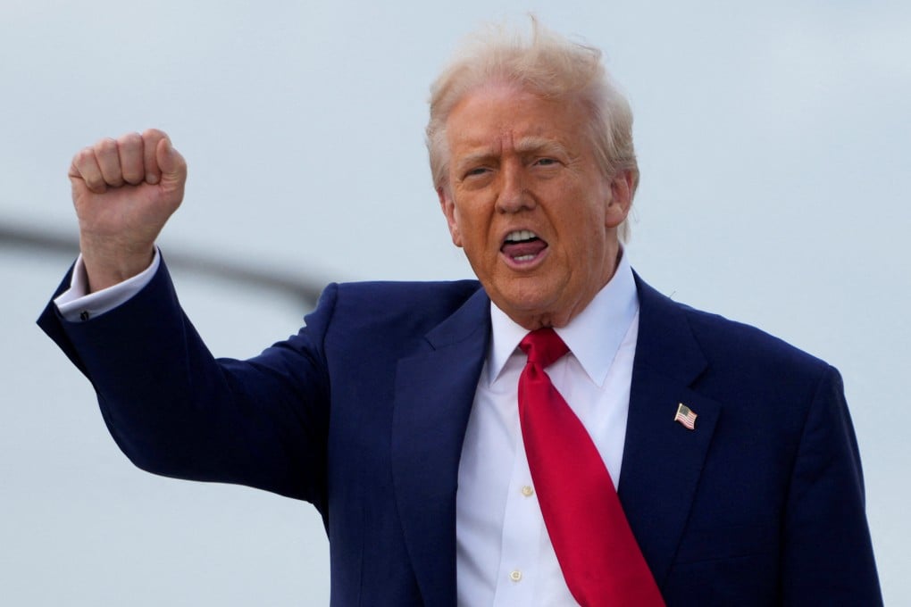 US President Donald Trump gestures as he disembarks from Air Force One in Miami, Florida, on Thursday. Photo: Reuters