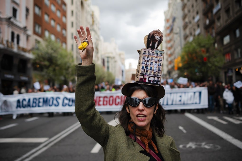 A woman takes part in a demonstration in Madrid to demand intervention in the housing market. After several mass demonstrations in different parts of Spain, tenants’ unions, mortgage platforms and assemblies against evictions, among other groups, have called the first statewide demonstration for the right to housing. Photo: dpa