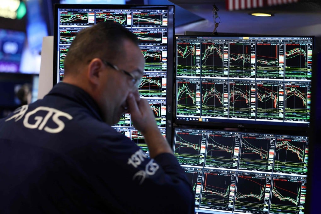 A trader on the floor of the New York Stock Exchange (NYSE) at the opening bell in New York City, on April 2, 2025. Photo: AFP
