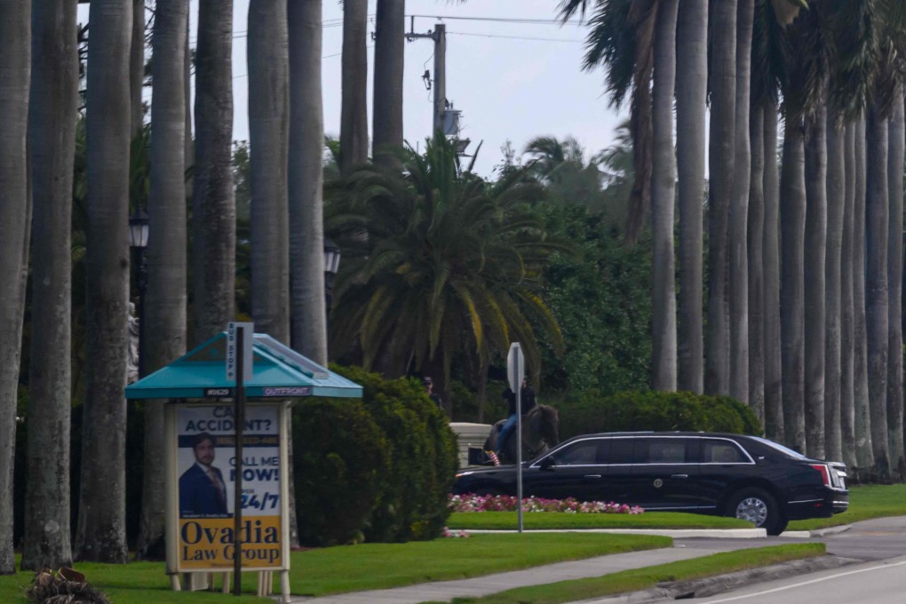 A limousine in US President Donald Trump’s motorcade pulls into the Trump International Golf Club West Palm Beach, Florida, on Friday. Photo: AFP