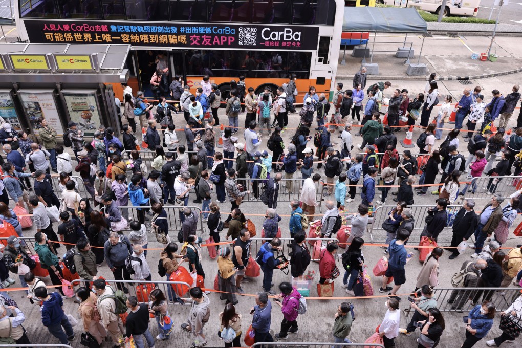 Grave sweepers form long queues at the Chai Wan bus terminal, waiting for buses to Chai Wan Cemetery on Friday. Photo: Nora Tam