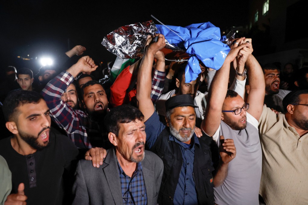 Palestinians carry the body of Palestinian-American teenager Omar Muhammad Saadeh Rabee, who was killed by Israeli forces in the West Bank on Sunday. Photo: Reuters