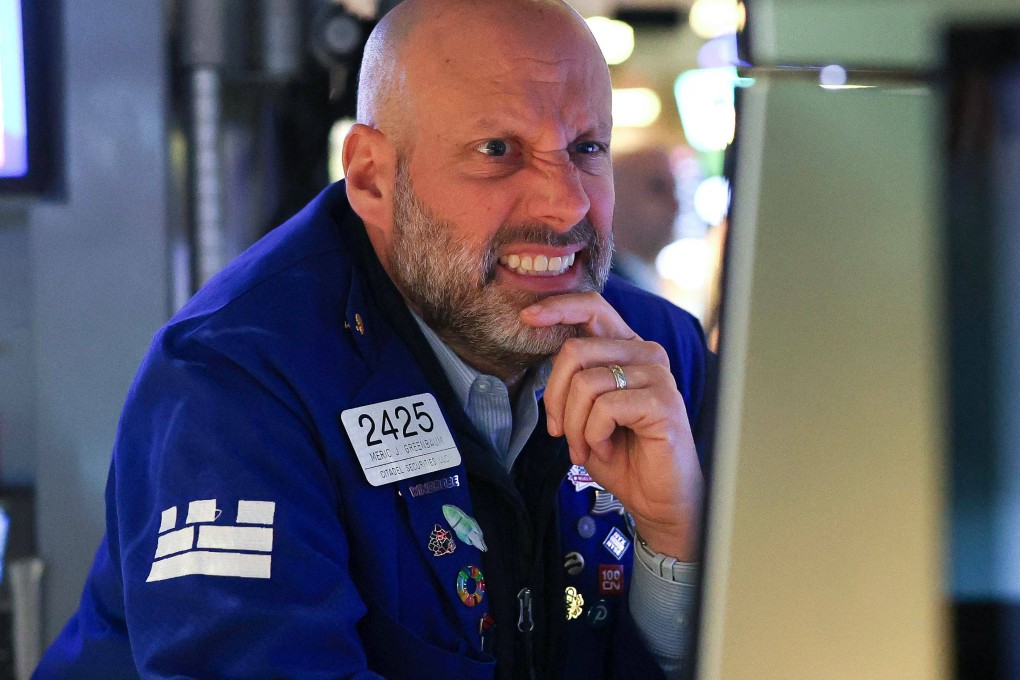 A trader works on the floor of the New York Stock Exchange at the opening bell in New York City on Monday. Photo: AFP
