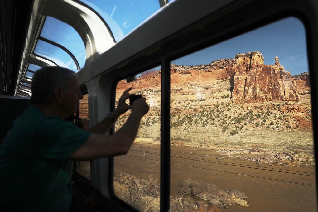 Passengers enjoy the sightseer lounge car on Amtrak’s California Zephyr, which runs between the San Francisco Bay Area and Chicago, Illinois, in 51 hours and 20 minutes. Photo: Getty Images via AFP