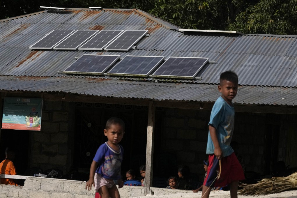 Solar panels on the roof of a house in a village on Sumba Island, Indonesia. China is set to cement its lead in the global clean energy market, analysts say. Photo: AP