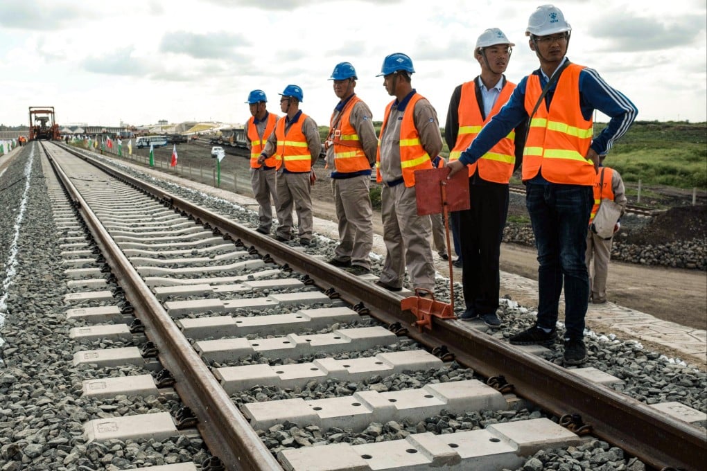 Chinese workers on a section of the Standard Gauge Railway in 2018, before a presidential inspection of the Nairobi-Naivasha Phase 2A project. A Chinese consortium will provide 40 per cent of the funding for the 475km line from Naivasha to Malaba. Photo: AFP