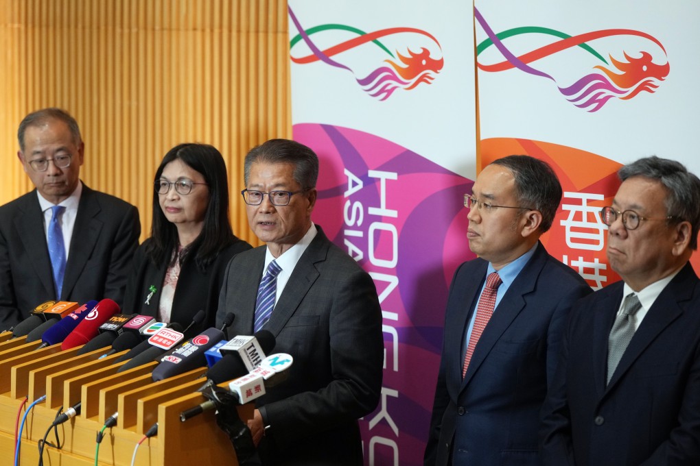 Finance chief Paul Chan (centre) meets the press flanked by Hong Kong Monetary Authority chief executive Eddie Yue Wai-man (left), Securities and Futures Commission CEO Julia Leung (second left), treasury minister Christopher Hui Ching-yu (second right) and commerce chief Algernon Yau Ying-wah (right). Photo: Sam Tsang