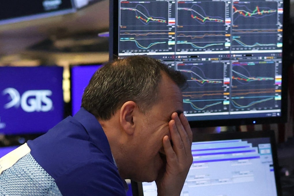 A trader works on the floor at the New York Stock Exchange. Photo: AFP