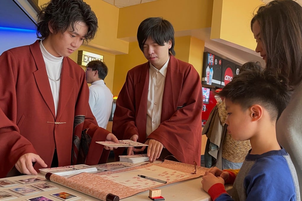 Zhao Yuanyuan (right) takes her son to a community-organised IMAX screening of Chinese blockbuster Ne Zha 2 in the US state of Maryland. Similar screenings have been organiser elsewhere in the United States. Photo: AP