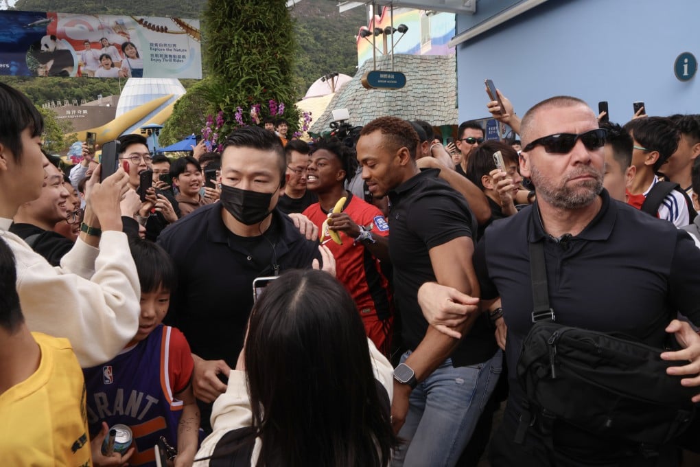 YouTube star IShowSpeed (in a red jersey) leaves Hong Kong’s Ocean Park accompanied by a large number of bodyguards, on April 4. Photo: Jelly Tse