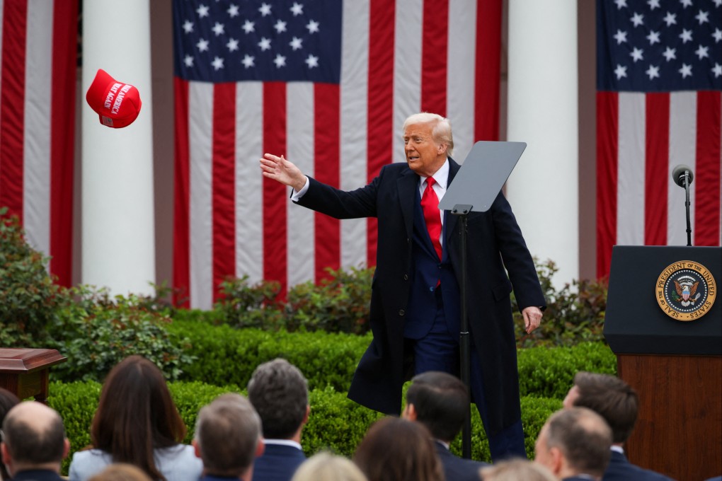 US President Donald Trump tries to reach toward a Maga hat during remarks on tariffs in the Rose Garden at the White House on April 2. Photo: Reuters