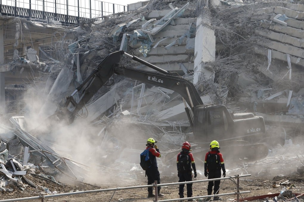 Rescuers conduct a search for survivors on March 29 at the site of the collapsed State Audit Office tower building in Bangkok. Photo: EPA-EFE