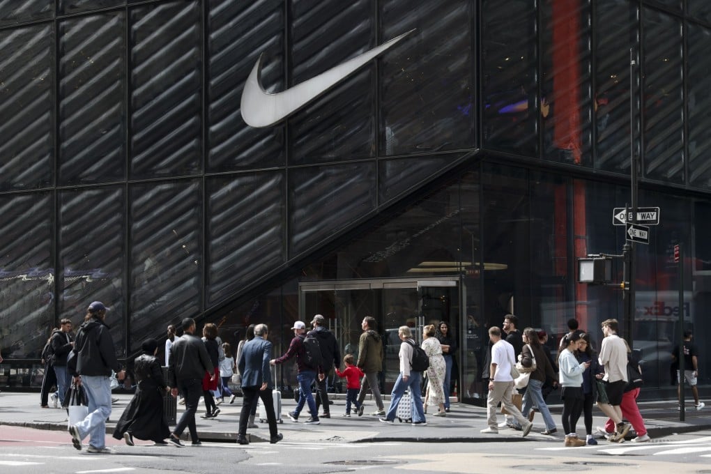 People pass by a Nike store in New York. Kimbal Musk called Donald Trump’s tariffs a “permanent tax on the American consumer”. Photo: EPA-EFE
