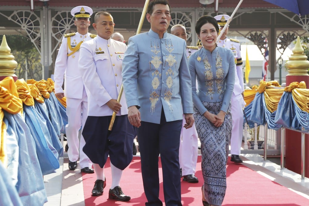 Thai King Maha Vajiralongkorn (centre) with his royal noble consort Sineenat Wongvajirabhakdi (right). Photo: AP