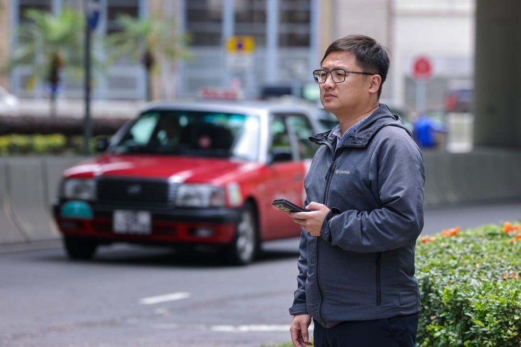 Lawmaker Gary Zhang Xinyu, who is also a member of the Legislative Council’s transport panel, attempts to book a ride with premium taxi fleet “JOIE” without success. Photo: Nora Tam
