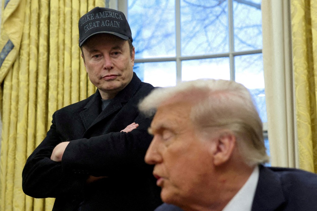 Elon Musk listens to US President Donald Trump in the Oval Office. Photo: Reuters