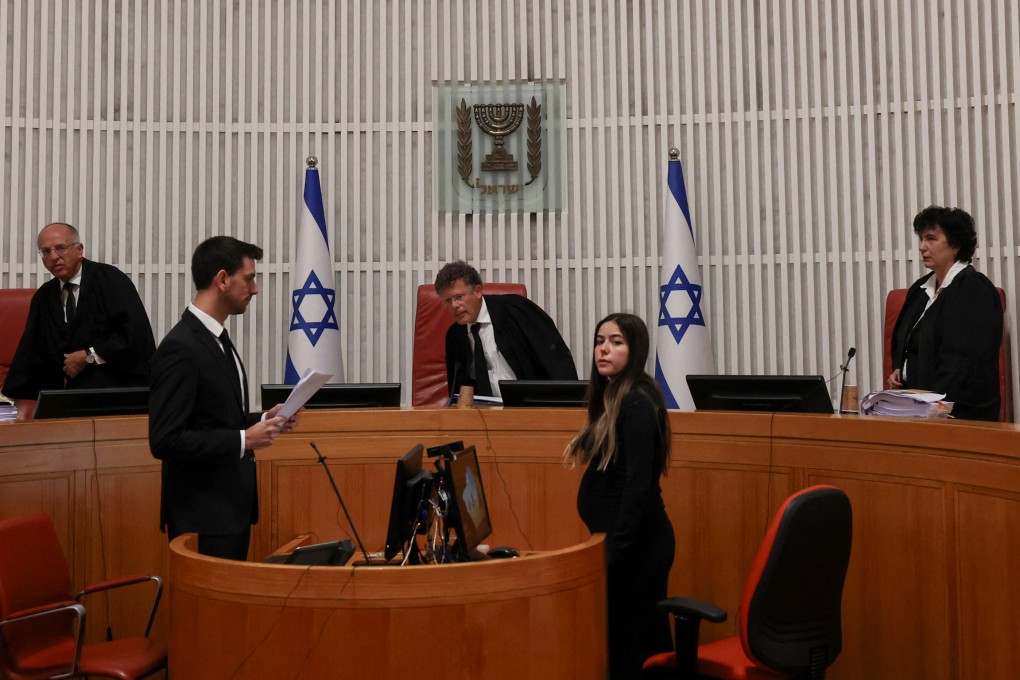 Israeli Supreme Court judges take seat on the day they preside over a hearing on the government’s dismissal of the head of the domestic intelligence service. Photo: Reuters