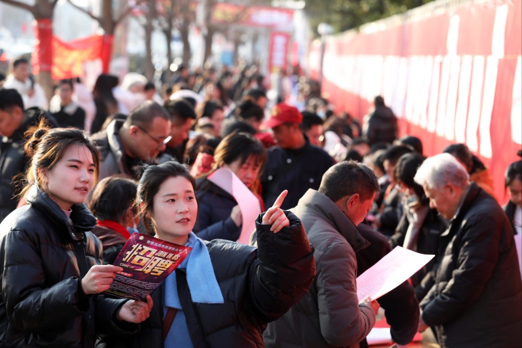 People attend a job fair in east China’s Anhui province on January 22. China’s slowing growth and structural changes to the economy have left many young people jobless, including many with university degrees. Photo: Xinhua