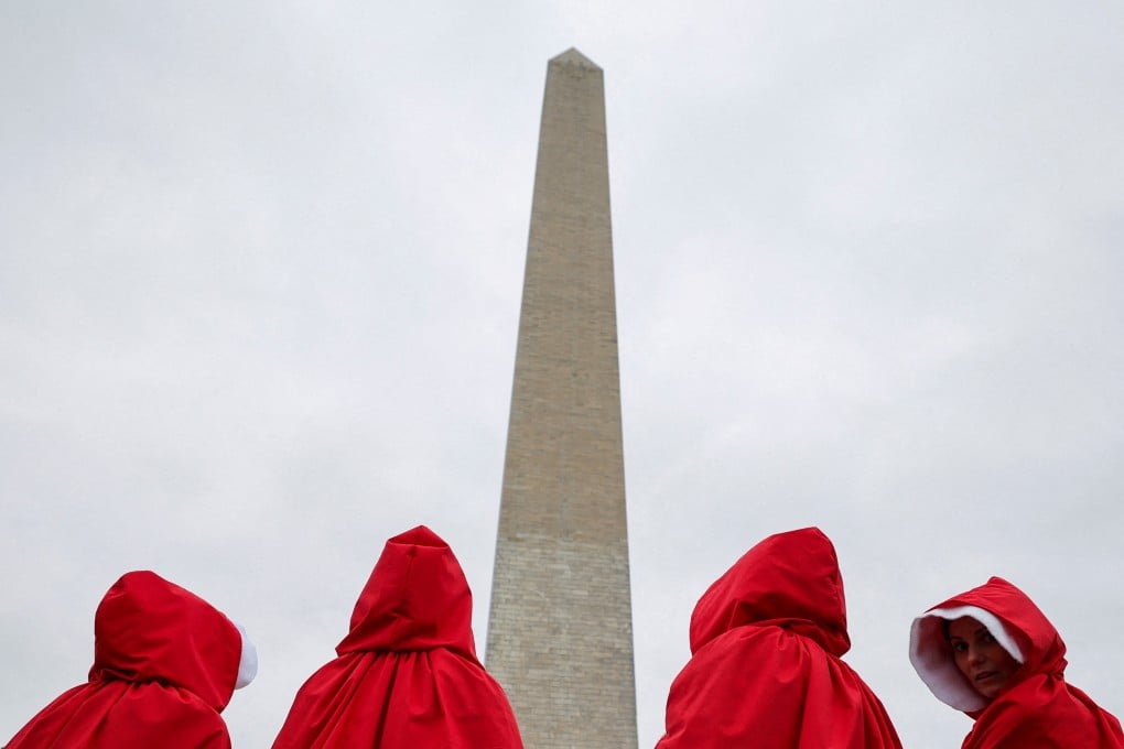 Demonstrators dressed as handmaidens from ‘The Handmaid’s Tale’ take part in a ‘Hands Off!’ protest against US President Donald Trump and his adviser Elon Musk at the Washington Monument on April 5. Photo: Reuters