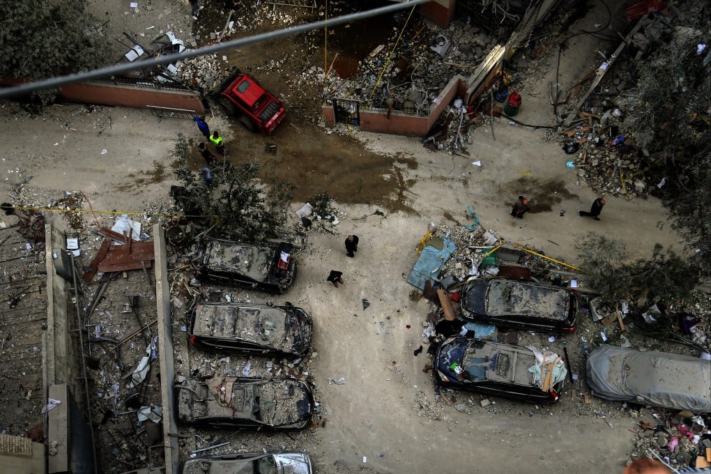 People inspect destroyed cars after an Israeli air strike hit a building in Beirut’s southern suburbs, a Hezbollah stronghold, on April 1. Photo: ZUMA Press Wire/dpa