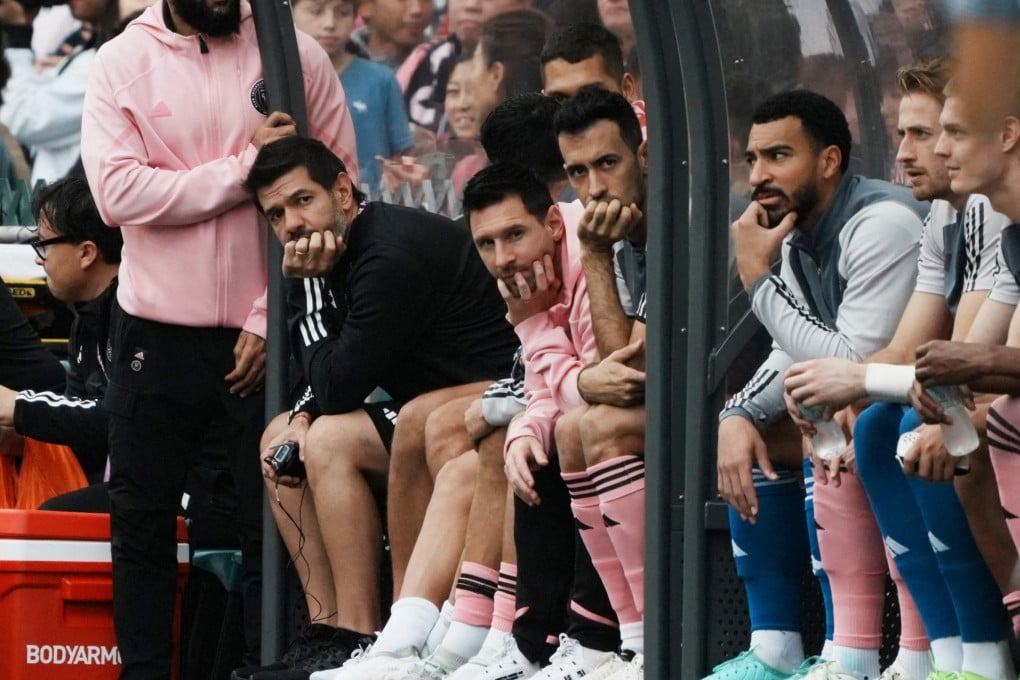 Inter Miami’s Lionel Messi (centre, in pink) and teammates sit on the substitute bench during a friendly match in February 2024. Messi had to sit the game out due to an injury, disappointing many of Hong Kong’s football fans. Photo: Reuters