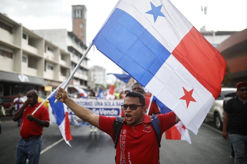A protester in Panama City waves a Panamanian flag during a demonstration against the visit of US Defence Pete Hegseth on Tuesday. Photo: EPA-EFE