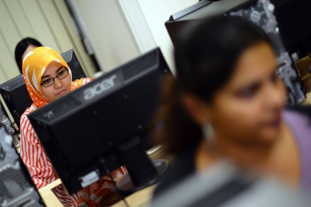 Students prepare for an exam in front of their computers at Kuala Lumpur-based Asia e University (AeU). Photo: AFP