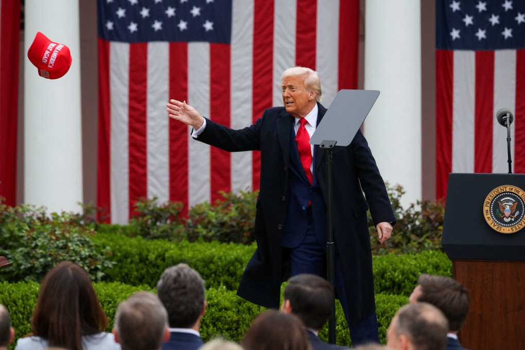 US President Donald Trump tossing a MAGA hat into the audience at the event announcing his tariffs programme on April 2. A week later, the uproar against it has only gotten louder. Photo: Reuters
