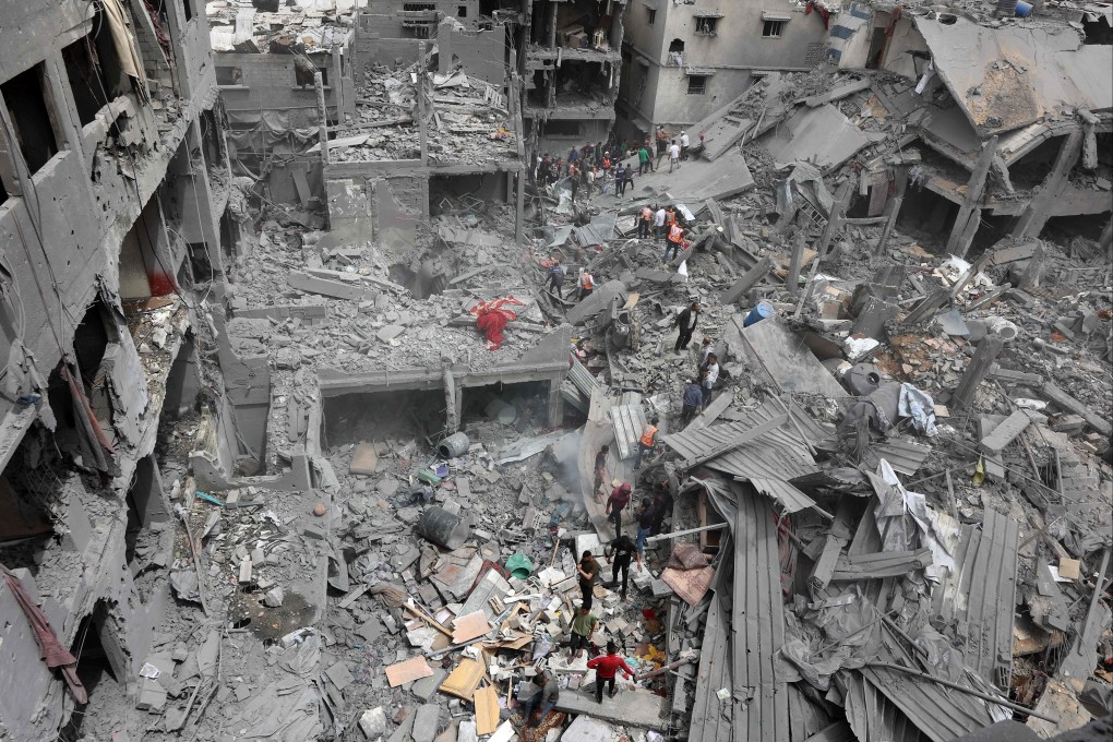 Rescuers work at the site of an Israeli strike on a residential area in Shujaiyya, Gaza City, on April 9. Photo: AFP